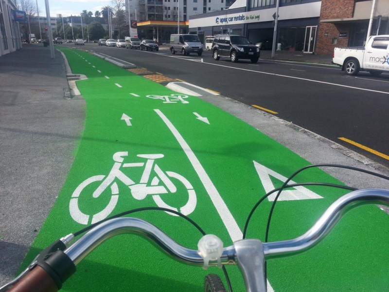 The yellow-and-black bumblebee bumpers allow access to driveways along Beach Rd. (Pic via Transportblog)