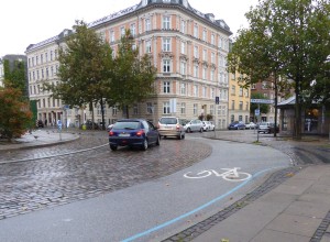 In Copenhagen cars are on cobbles while bikes are on smooth tarmac