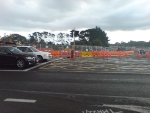 Cycleway blocked by orange barriers. No warning, no diversion signage. Traffic runs unimpeded.