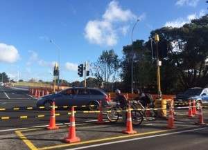 Looking south across Gt Nth Rd: a signalised crossing, then a zebra crossing that's generally respected by drivers, then a smooth new path across the bridge. 