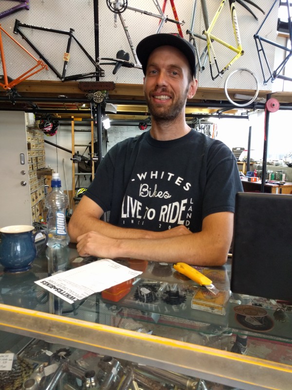 Tim White, one of the few Aucklanders who can claim to have a t-shirt with his very own bike shop on the front.