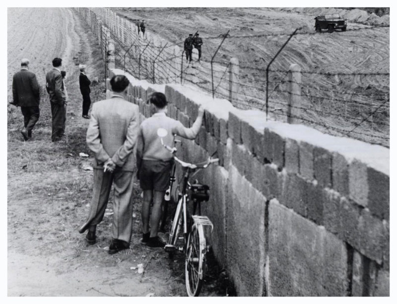 West Birkenheaders weighing up the risks of making a dash for it through Northcote Point. Or, West Berliners observing the creation of the 'death strip' on the East side. October 1961. 