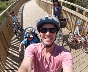 Saul and family on the new boardwalk through Pt Chev's Eric Armishaw Reserve.