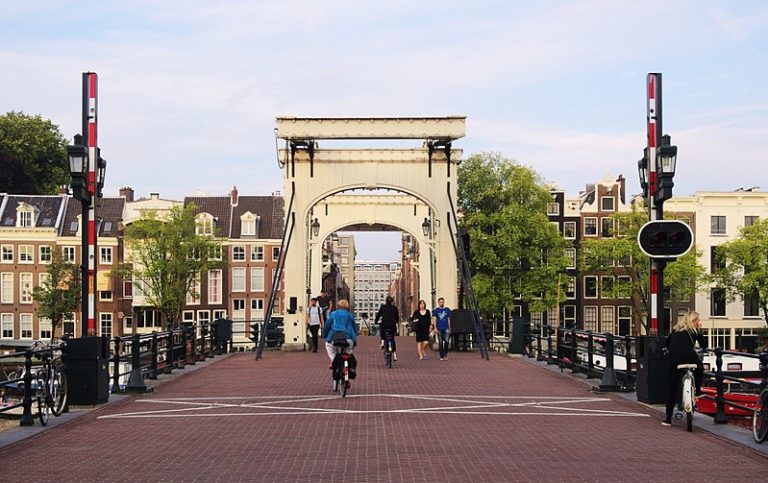 People walking and biking over Magere Brug