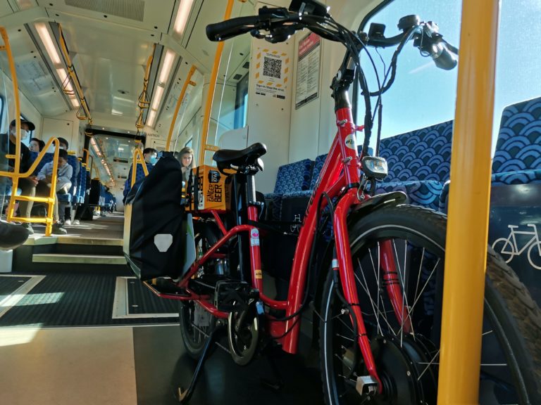 Juan takes his bike on the train.