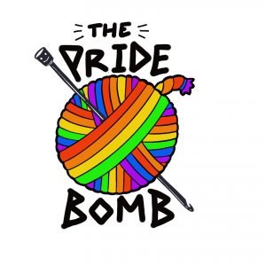 A rainbow ball of yarn with its end sticking out to make it look like a bomb, with the words 'the Pride Bomb'