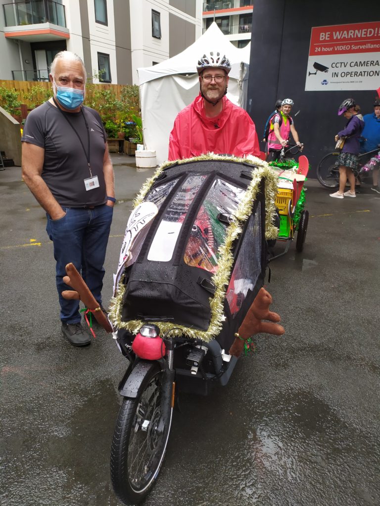 A cargo bike decorated to look like a reindeer