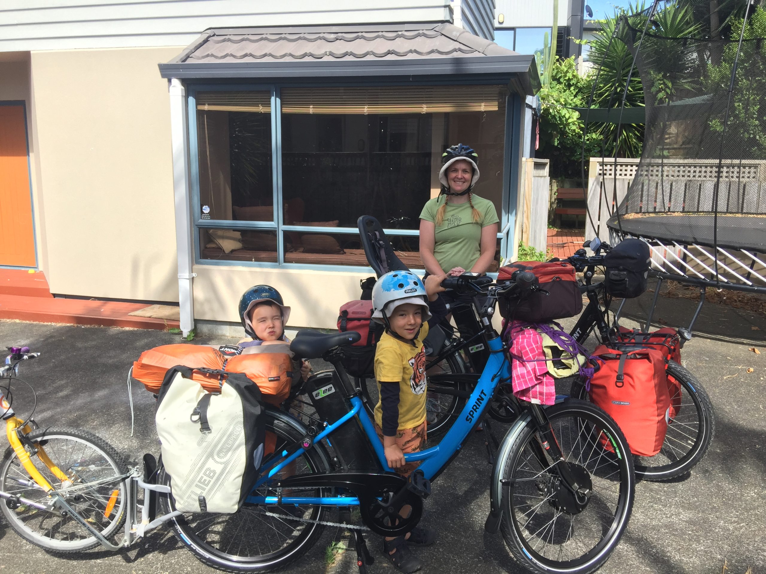 Family going on a camping holiday by e-bike