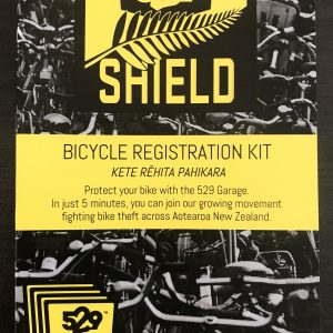 A grey, black, and yellow 4-shield 529 registration kit