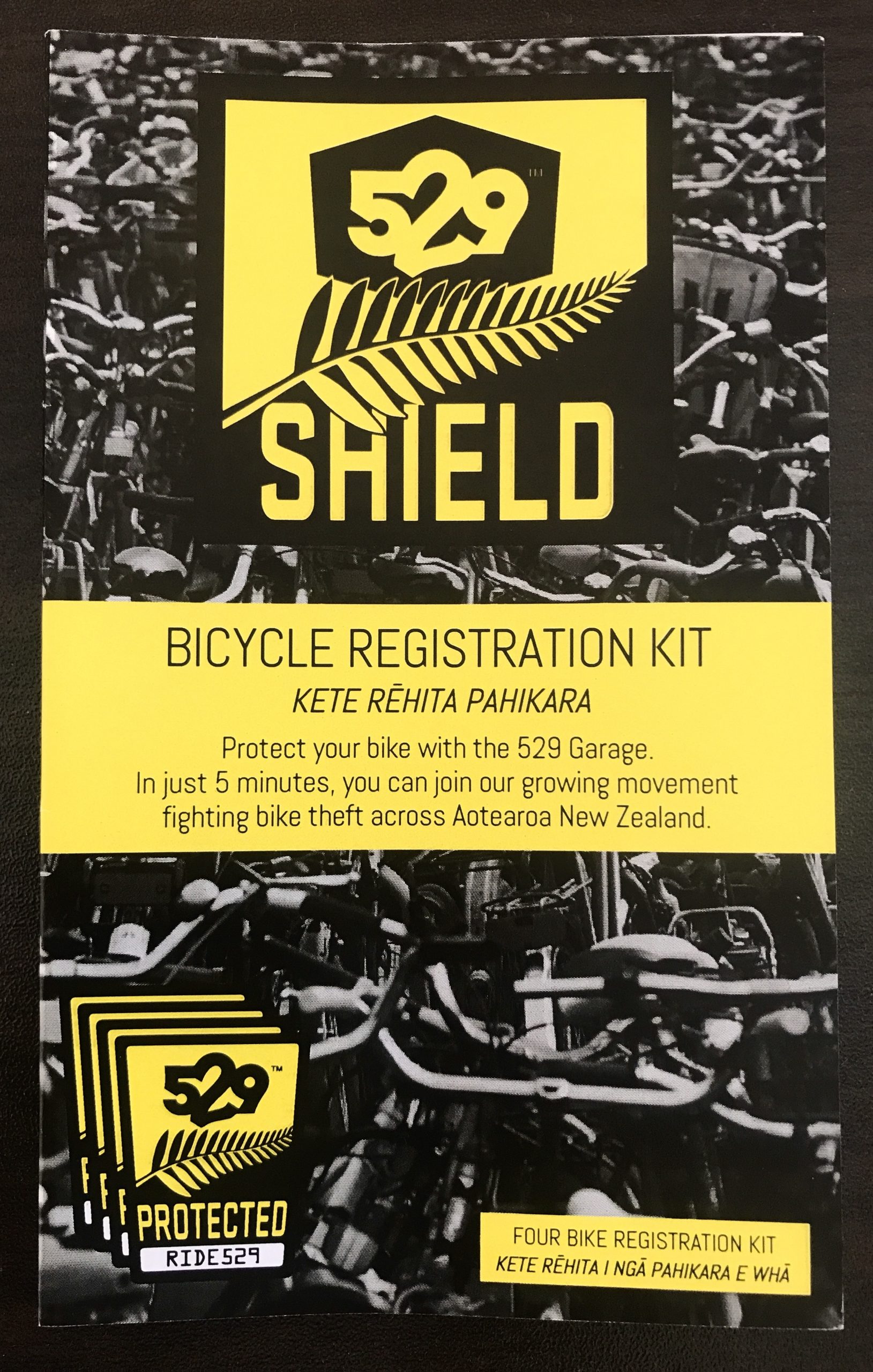 A grey, black, and yellow 4-shield 529 registration kit