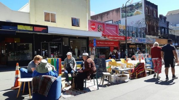 Photo of people having a picnic in a carpark