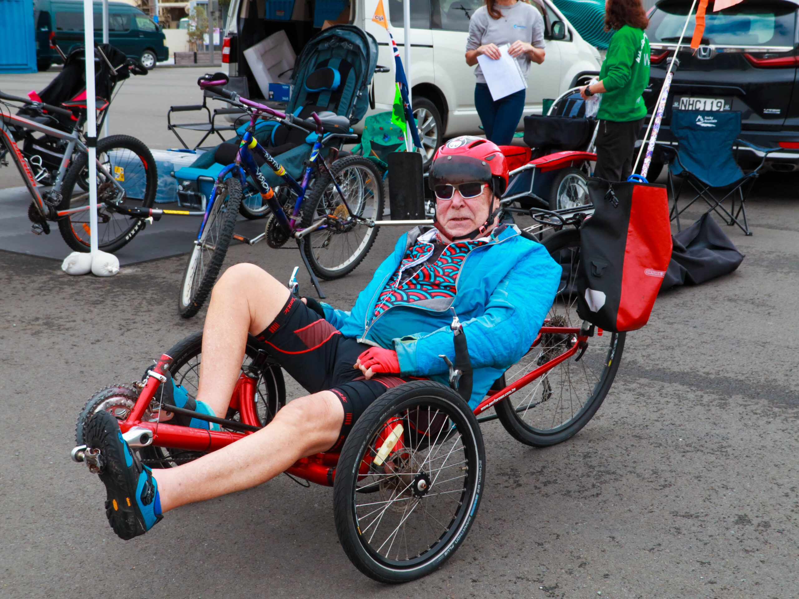 A person sitting in a recumbent cycle
