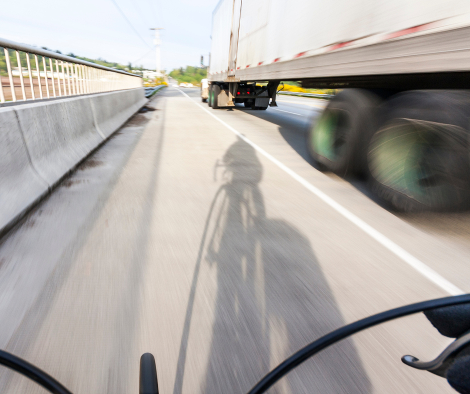 Truck passing cyclist