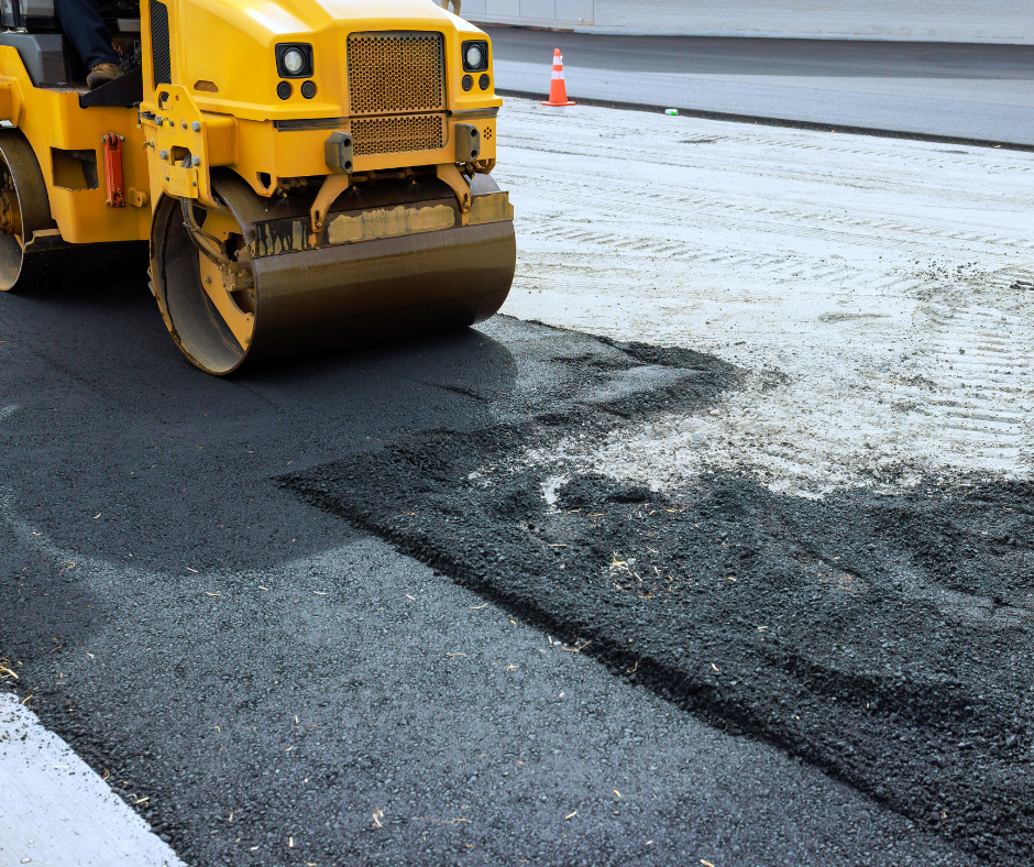 Road roller resurfaces tarmac